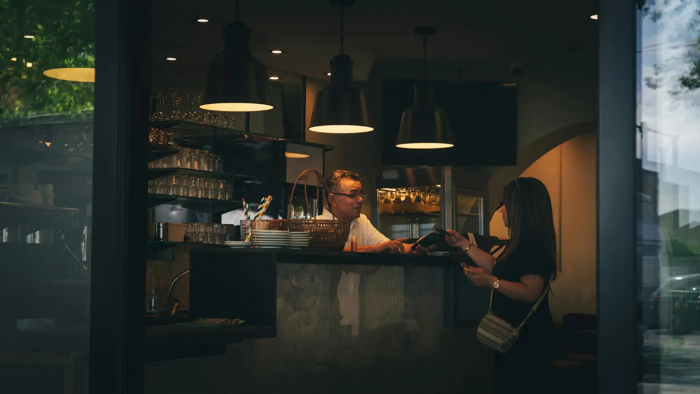 A card payment being taken on a small business counter